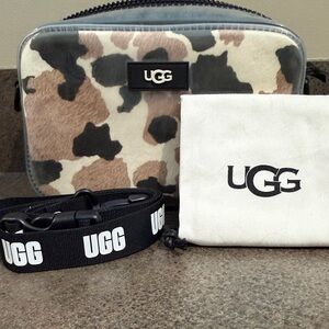 UGG Janey II Clear Calf Hair crossbody bag with a cow print design.
